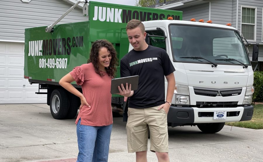 South Jordan junk removal professional interacting with a client